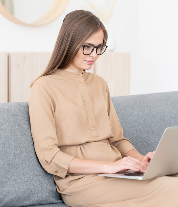 young-business-woman-sitting-on-sofa-with-open-laptop-working-from-home.jpg young-business-woman-sitting-on-sofa-with-open-laptop-working-from-home.jpg